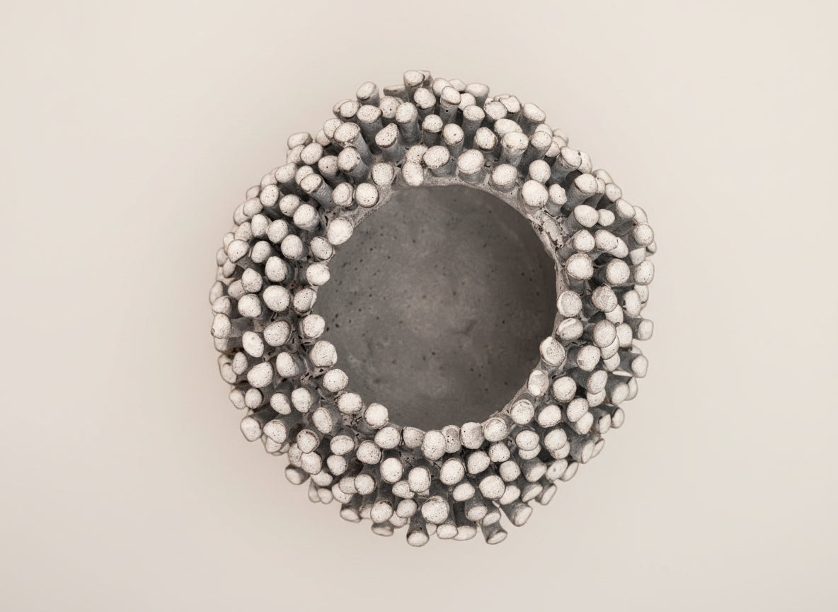 Decorative stone with textured surface on a wooden background